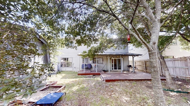 back of property with a wooden deck