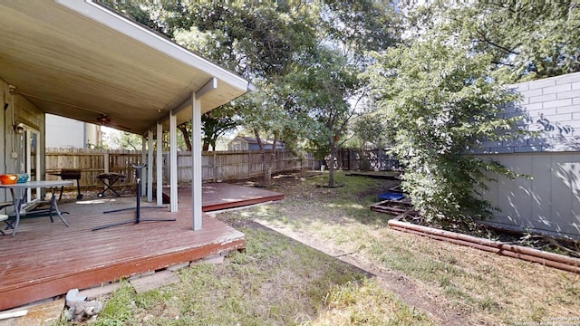 view of yard featuring a wooden deck