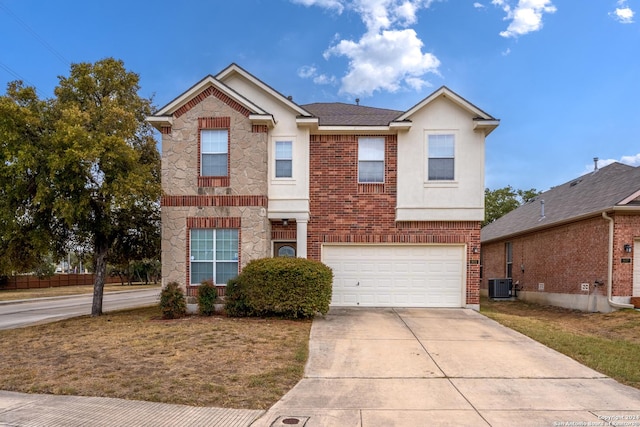 931 Palladio Pl, San Antonio, TX 78253 - view of front of home featuring an attached garage, central air condition unit, stone siding, driveway, and stucco siding