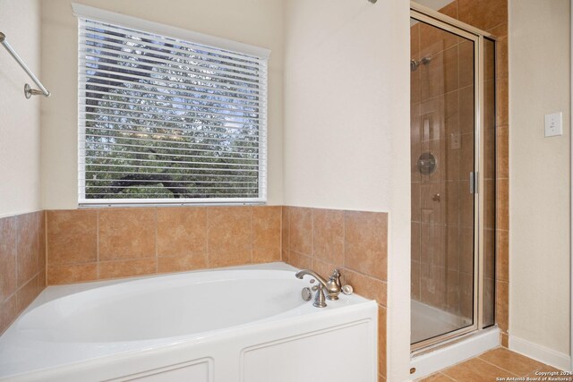 931 Palladio Pl, San Antonio, TX 78253 - bathroom featuring a stall shower, a bath, and tile patterned flooring