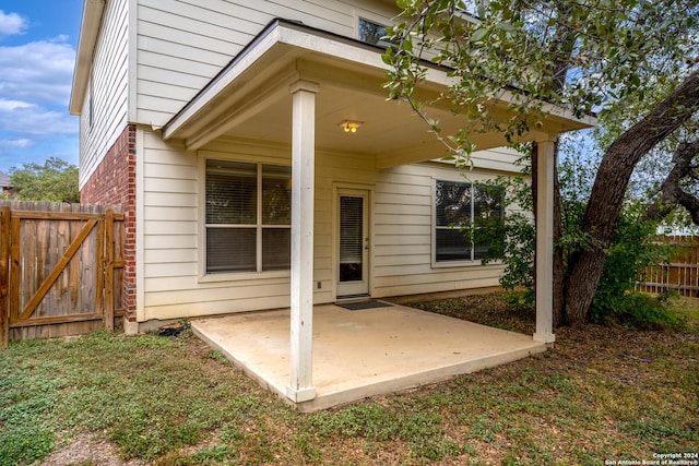 931 Palladio Pl, San Antonio, TX 78253 - rear view of property with a patio, fence, and brick siding