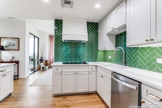 kitchen featuring white cabinets, dishwasher, light hardwood / wood-style floors, and sink