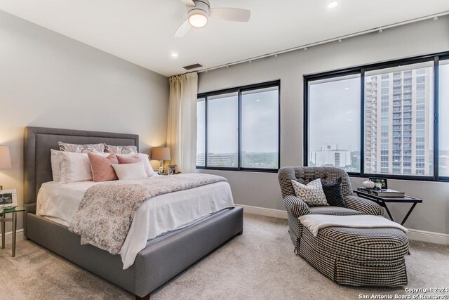 carpeted bedroom featuring ceiling fan