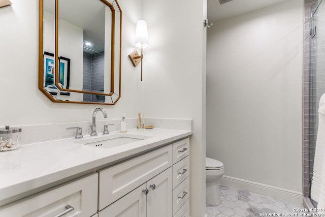 bathroom featuring tile patterned floors, vanity, and toilet