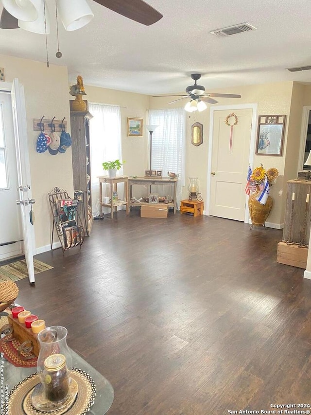 interior space with dark hardwood / wood-style floors and a textured ceiling