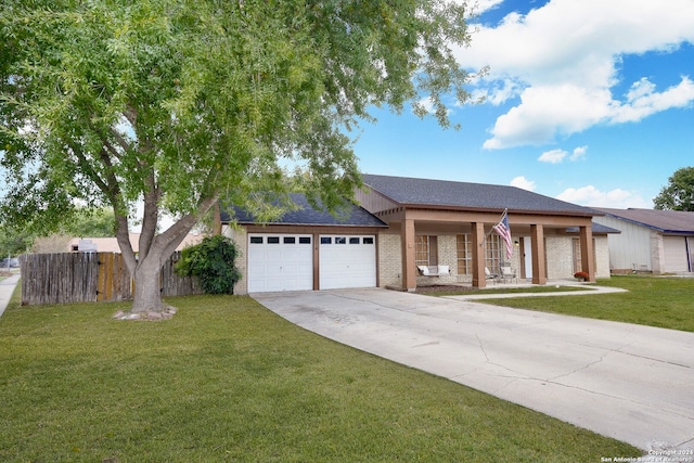 ranch-style home with a front lawn and a garage