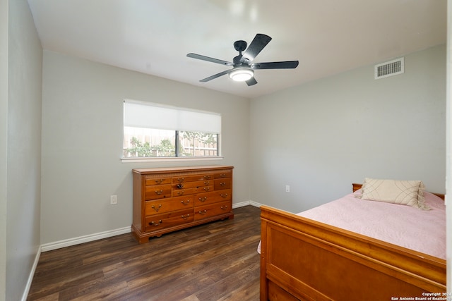 bedroom featuring dark hardwood / wood-style floors and ceiling fan