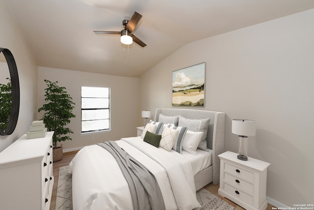 bedroom with lofted ceiling, light hardwood / wood-style flooring, and ceiling fan