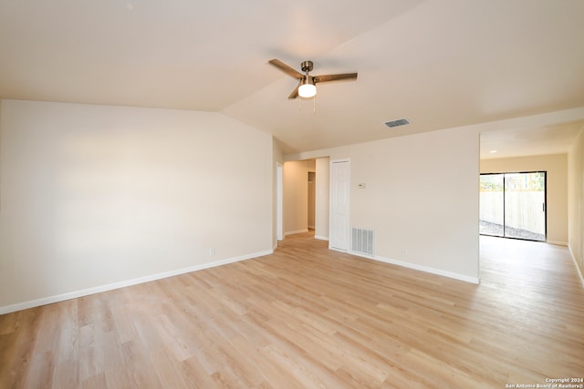 unfurnished room with lofted ceiling, light wood-type flooring, and ceiling fan