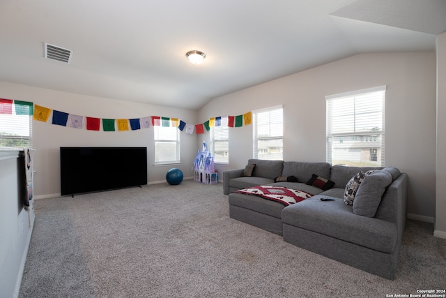 living room featuring carpet floors, a fireplace, and vaulted ceiling