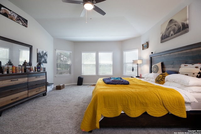 carpeted bedroom with lofted ceiling and ceiling fan