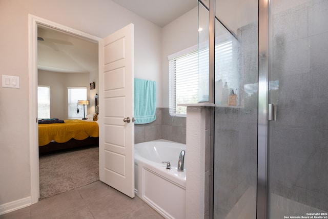 bathroom with tile patterned floors, a wealth of natural light, and plus walk in shower