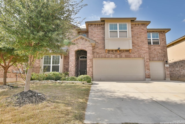 view of front of property with a garage