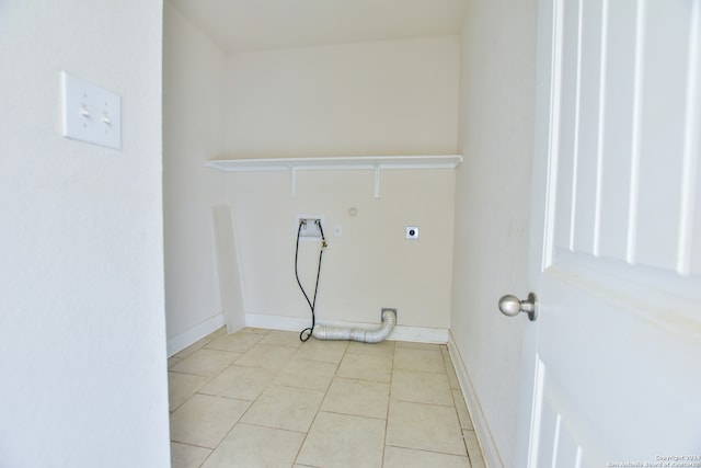 washroom featuring hookup for an electric dryer, hookup for a washing machine, and light tile patterned floors