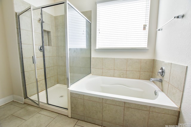 bathroom with tile patterned floors and plus walk in shower