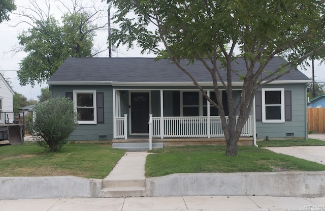 view of front facade with a porch and a front yard