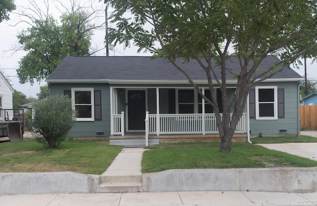 2407 W Mistletoe Ave, San Antonio, TX 78228 - view of front of home with crawl space, a porch, and a shingled roof