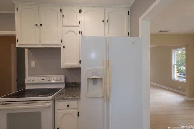 2407 W Mistletoe Ave, San Antonio, TX 78228 - kitchen featuring white appliances, white cabinets, light wood-style floors, and baseboards