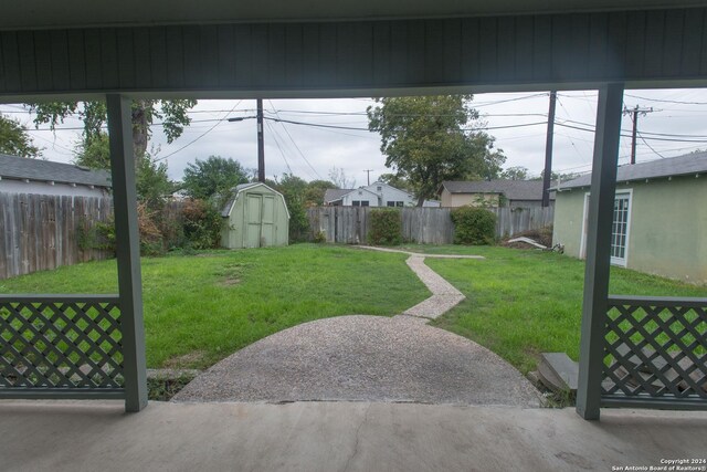 2407 W Mistletoe Ave, San Antonio, TX 78228 - view of yard with a storage unit and an outbuilding