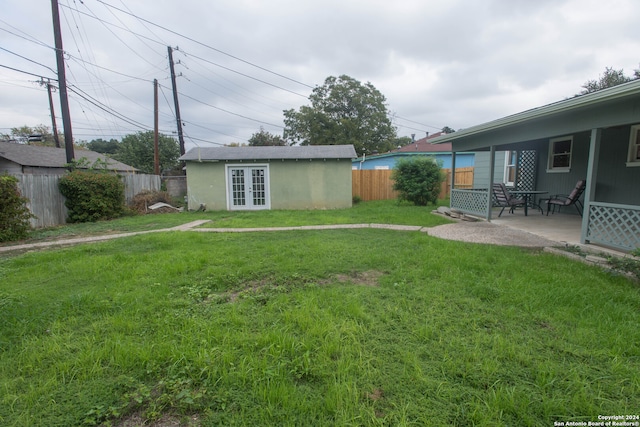 view of yard with a patio and an outdoor structure