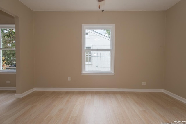 2407 W Mistletoe Ave, San Antonio, TX 78228 - unfurnished room featuring light wood finished floors and baseboards