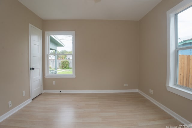 spare room with light wood-type flooring