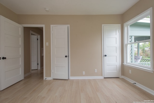 unfurnished bedroom featuring light hardwood / wood-style floors