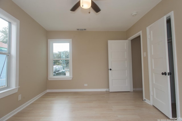 2407 W Mistletoe Ave, San Antonio, TX 78228 - unfurnished bedroom featuring light wood finished floors, baseboards, and a ceiling fan