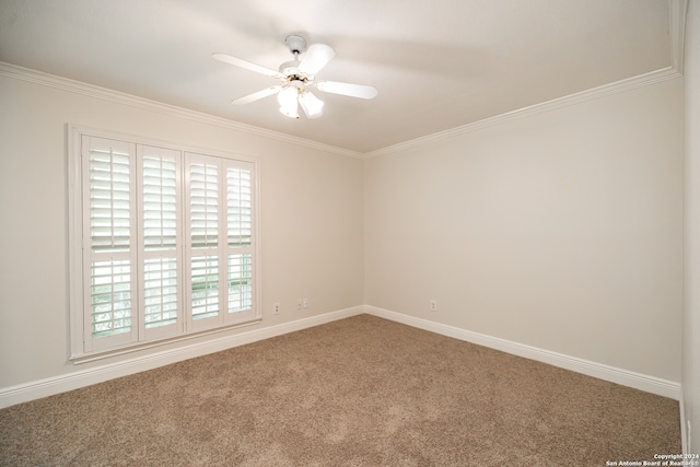 empty room featuring crown molding, carpet flooring, and ceiling fan