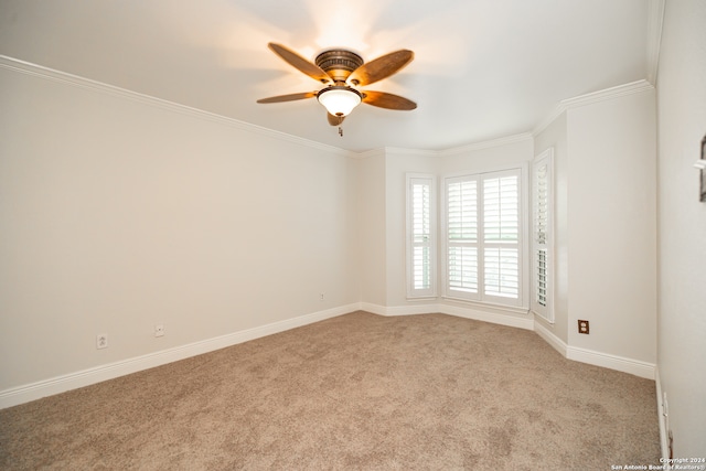 unfurnished room with light carpet, crown molding, and ceiling fan