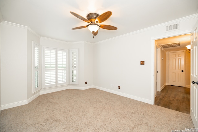 unfurnished room with ornamental molding, carpet flooring, and ceiling fan