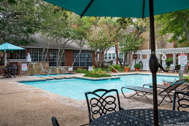 view of pool featuring a pergola and a patio area