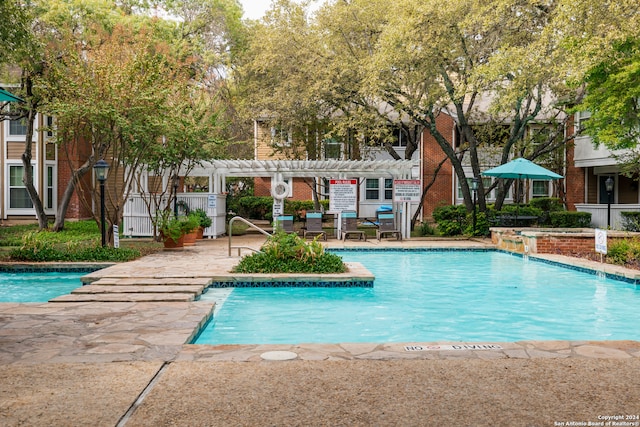 view of pool featuring a patio and a pergola