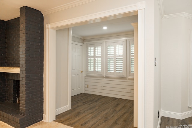 hall featuring crown molding and dark hardwood / wood-style floors