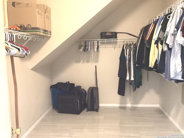 spacious closet featuring lofted ceiling