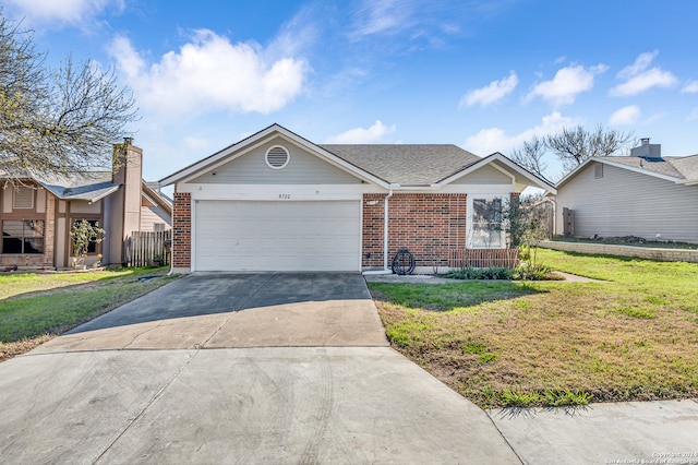 single story home with a front yard and a garage