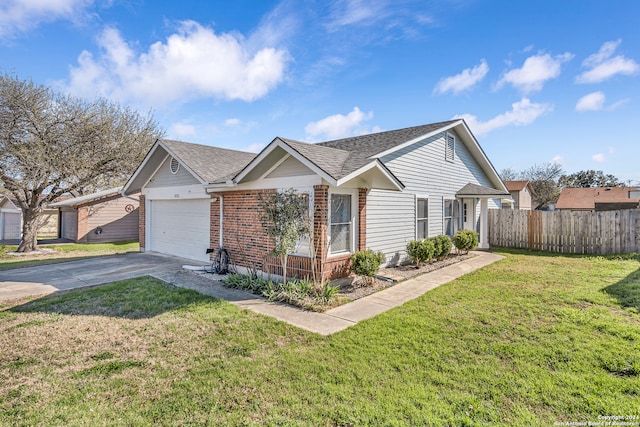 single story home featuring a front lawn and a garage