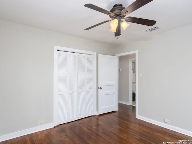 unfurnished bedroom with a closet, ceiling fan, and dark hardwood / wood-style floors