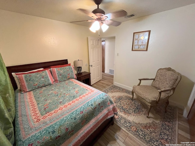 bedroom featuring hardwood / wood-style flooring and ceiling fan