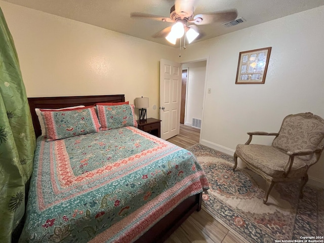 bedroom featuring wood-type flooring and ceiling fan