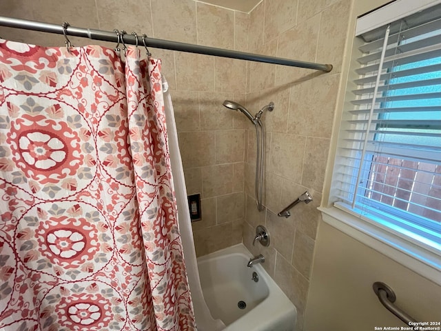 bathroom with shower / bath combo