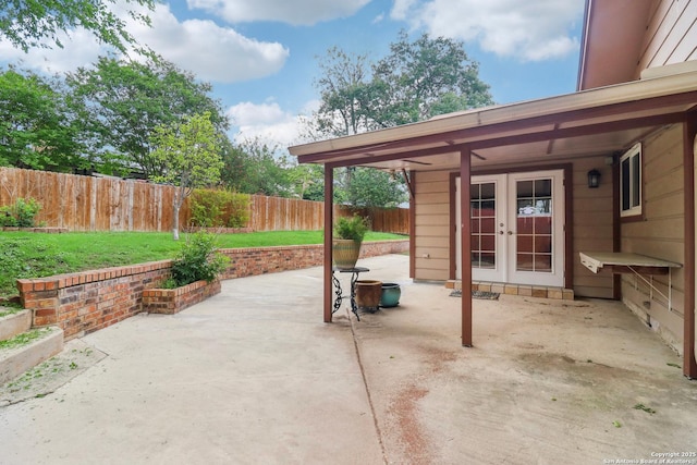 view of patio / terrace featuring a fenced backyard and french doors