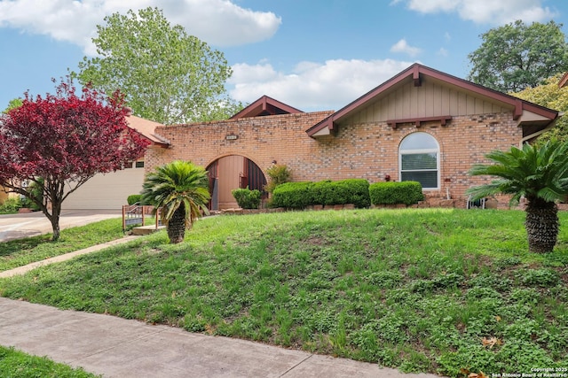 view of front facade featuring brick siding, concrete driveway, and an attached garage