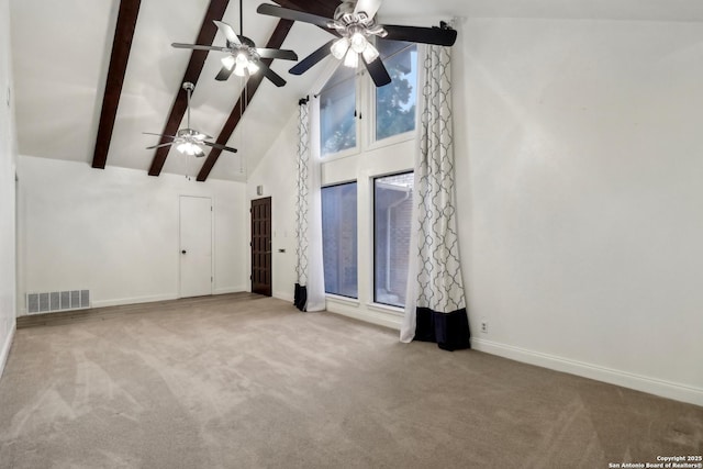 unfurnished room featuring beam ceiling, high vaulted ceiling, a ceiling fan, visible vents, and carpet floors