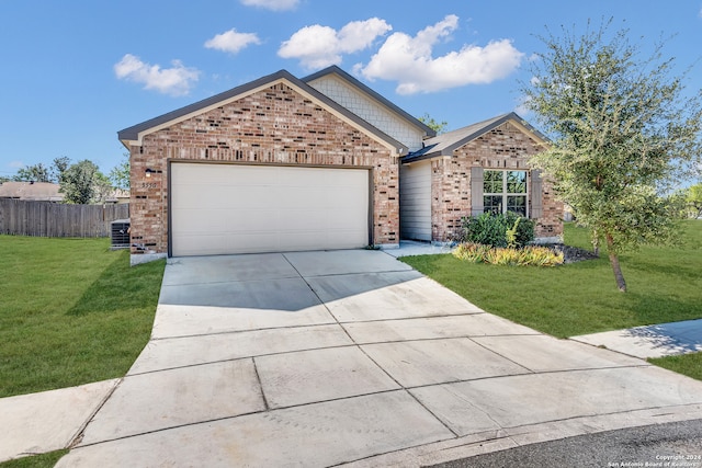 view of front of home featuring a front yard and a garage