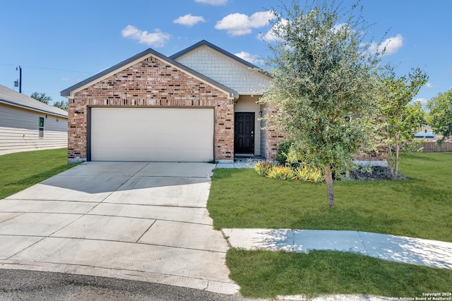 view of front of house with a garage and a front lawn