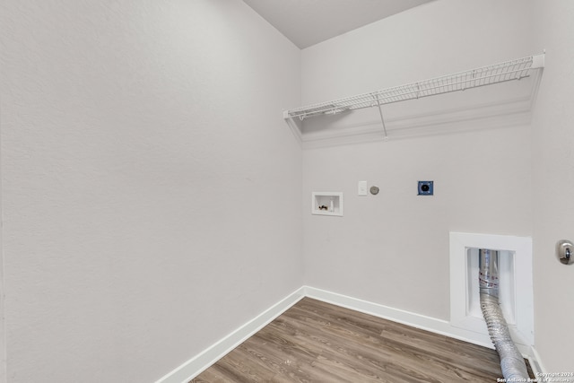 laundry area featuring dark wood-type flooring, electric dryer hookup, washer hookup, and hookup for a gas dryer