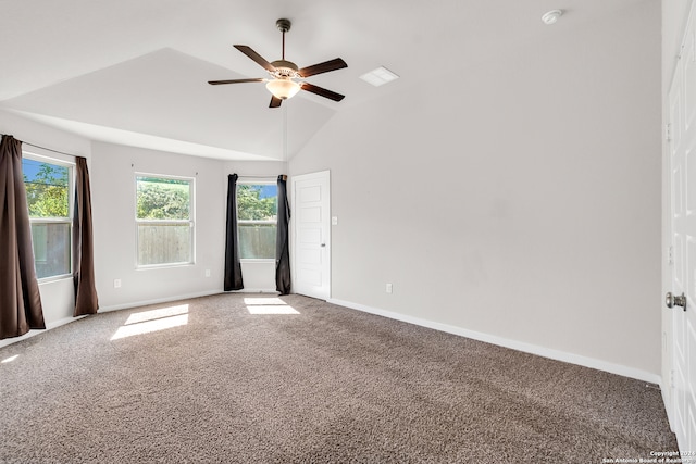 empty room with ceiling fan, carpet flooring, and vaulted ceiling