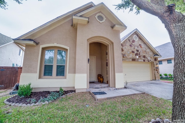 3718 Willow Walk, San Antonio, TX 78259 - view of front of house with a garage, stucco siding, driveway, and stone siding