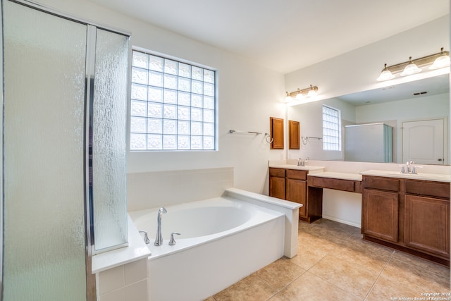 bathroom with vanity, independent shower and bath, and tile patterned flooring